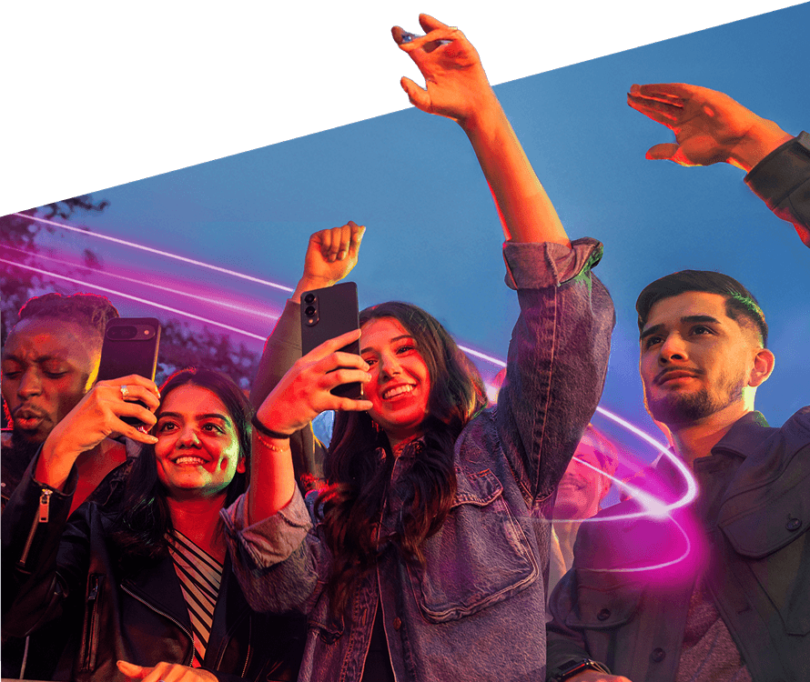 People raising their hands and phones